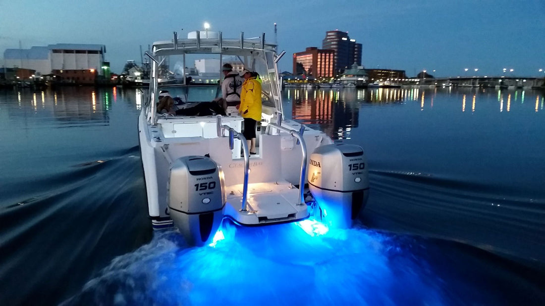 SeaBlaze X2 Spectrum underwater light, 6,000+ lumens, polished installed on center console moving at night.