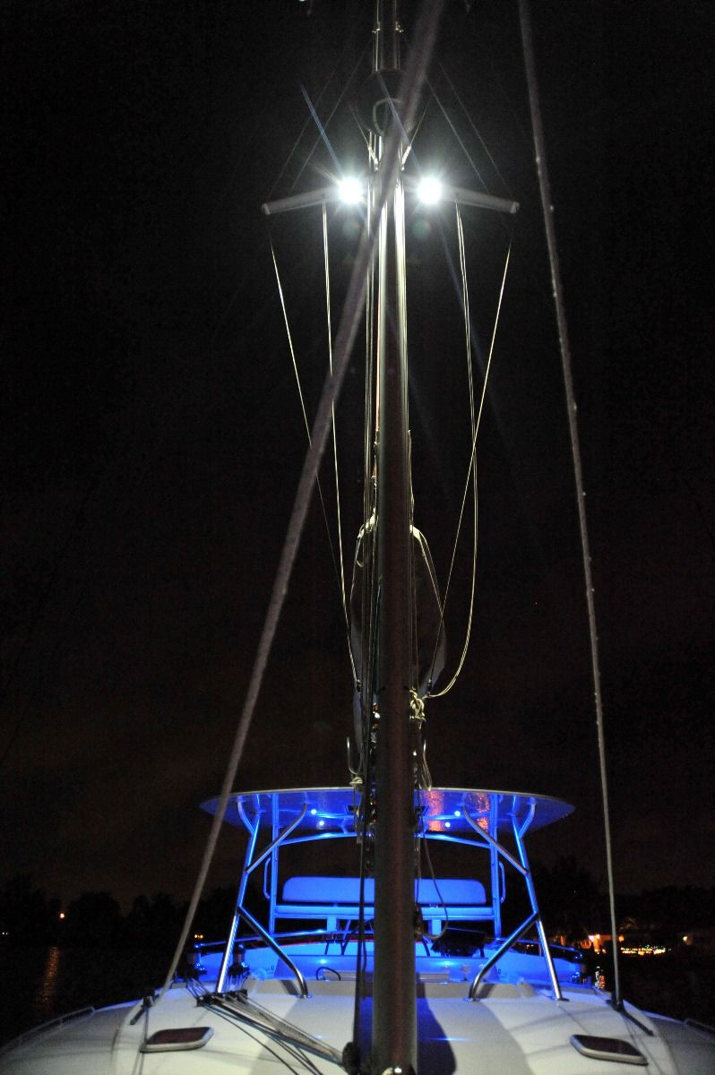 Lumitec Zephyr LED Spreader/Deck Light on sailboat mast at night