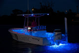 SeaBlaze Quattro Spectrum underwater light marine-grade bronze housing at night on center console.