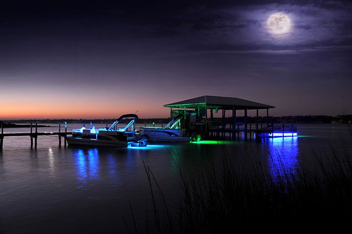 Zambezi X2 underwater light, 6,000+ lumens, Poco system compatible installed on pontoon boat at night with moon.
